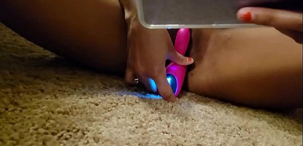  Mixed teen plays with toy.